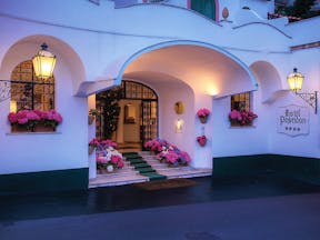 Hotel Poseidon Amalfi Coast entrance exterior flowers in window boxes and on stairs