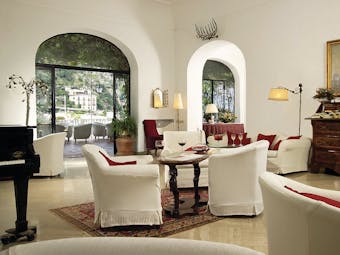 Hotel Poseidon Amalfi Coast indoor seating piano doors leading to outdoor terrace seating
