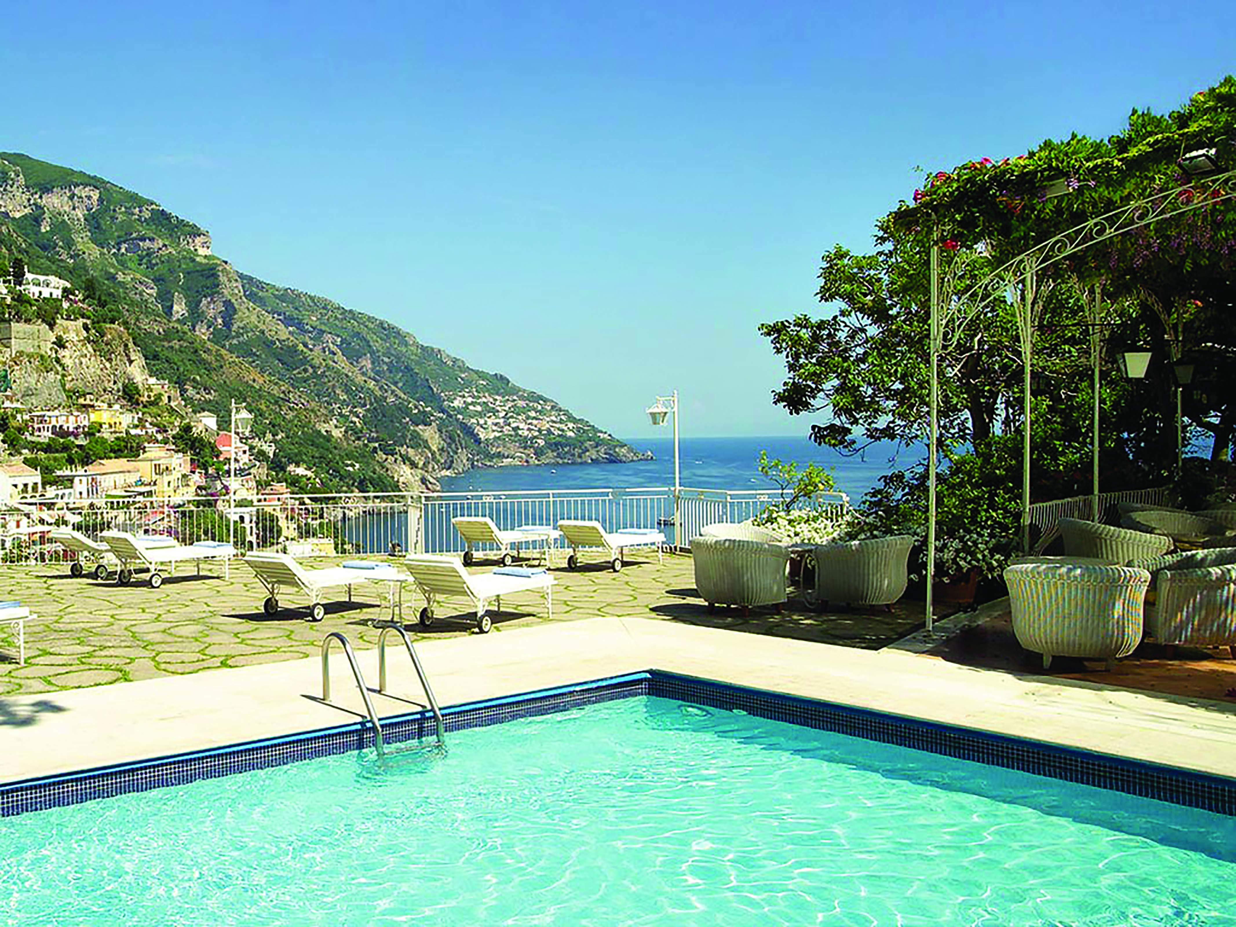 Hotel Poseidon Amalfi Coast pool sun loungers on terrace overlooking the sea