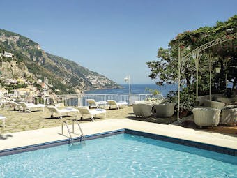 Hotel Poseidon Amalfi Coast pool sun loungers on terrace overlooking the sea