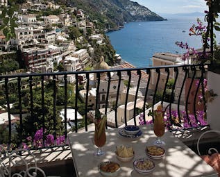 Hotel Poseidon Amalfi Coast superior balcony outdoor dining area overlooking the coast