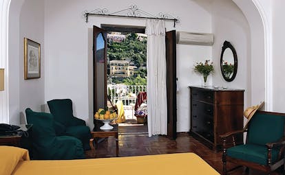 Hotel Poseidon Amalfi Coast superior suite lounge indoor seating area leading to balcony