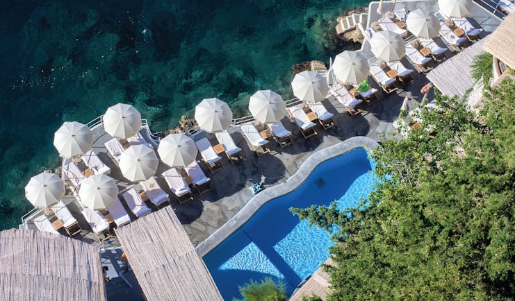 Hotel Santa Caterina Amalfi Coast beach club aerial shot sun loungers umbrellas pool