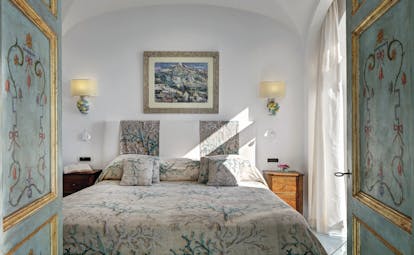 Hotel Santa Caterina Amalfi Coast suite bedroom panelled doors bed