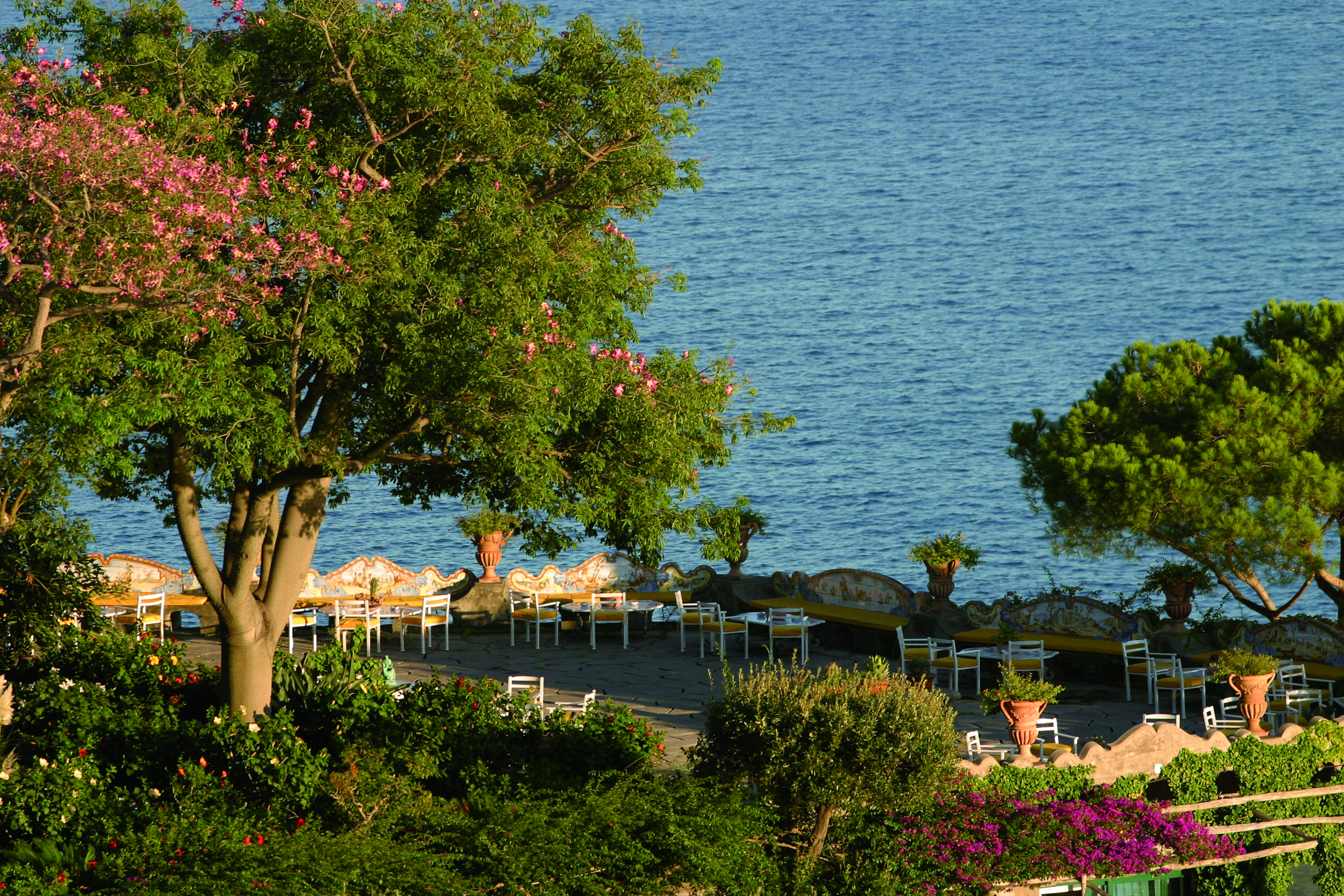 View from the grand terrace at the Il San Pietro Di Positano, looking over greenery and onto the sea