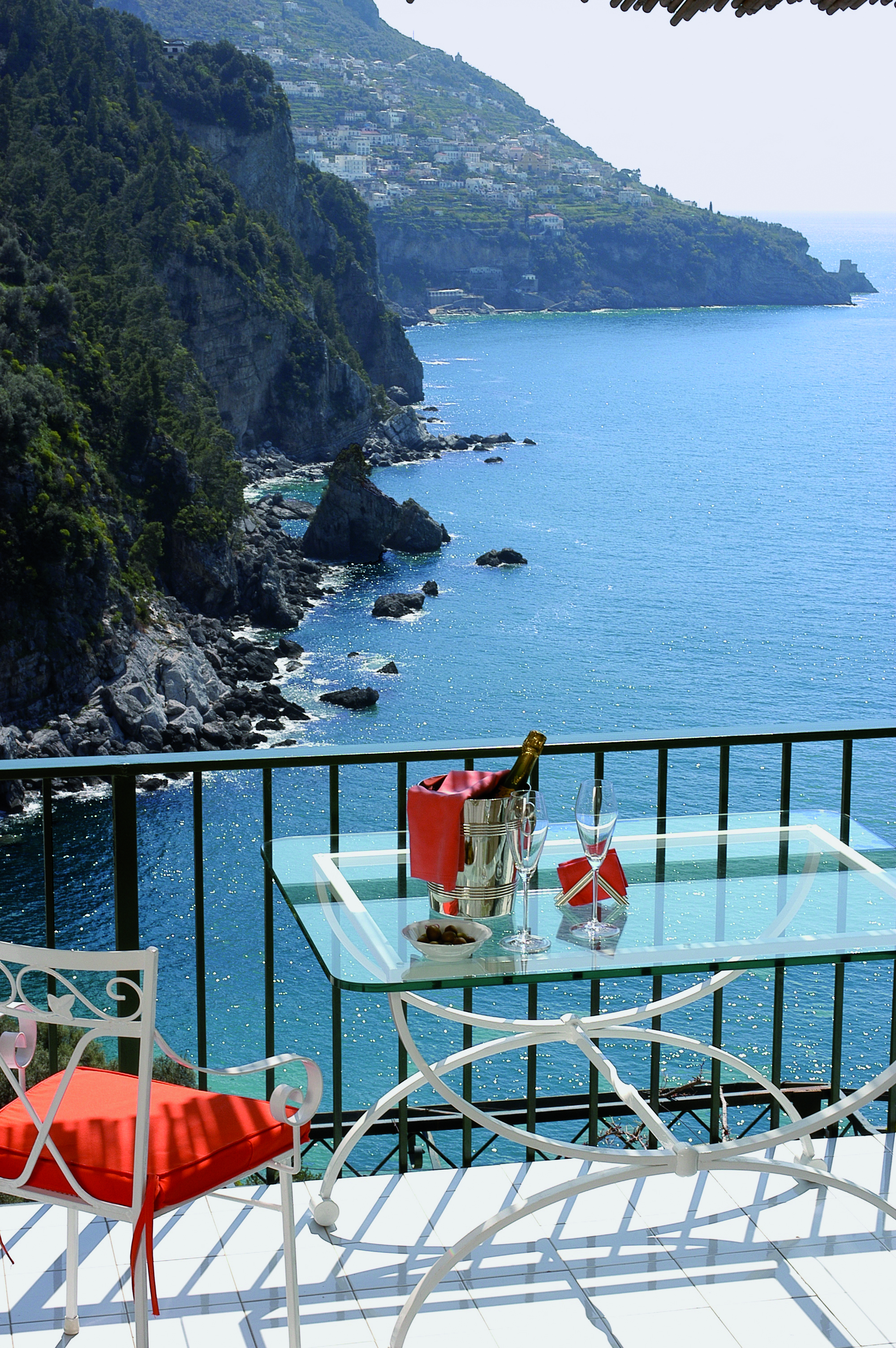 View from a terrace at the Il San Pietro Di Positano looking over mountains and the ocean
