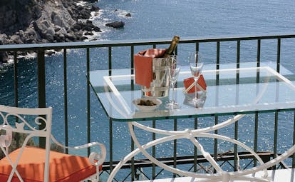 View from a terrace at the Il San Pietro Di Positano looking over mountains and the ocean