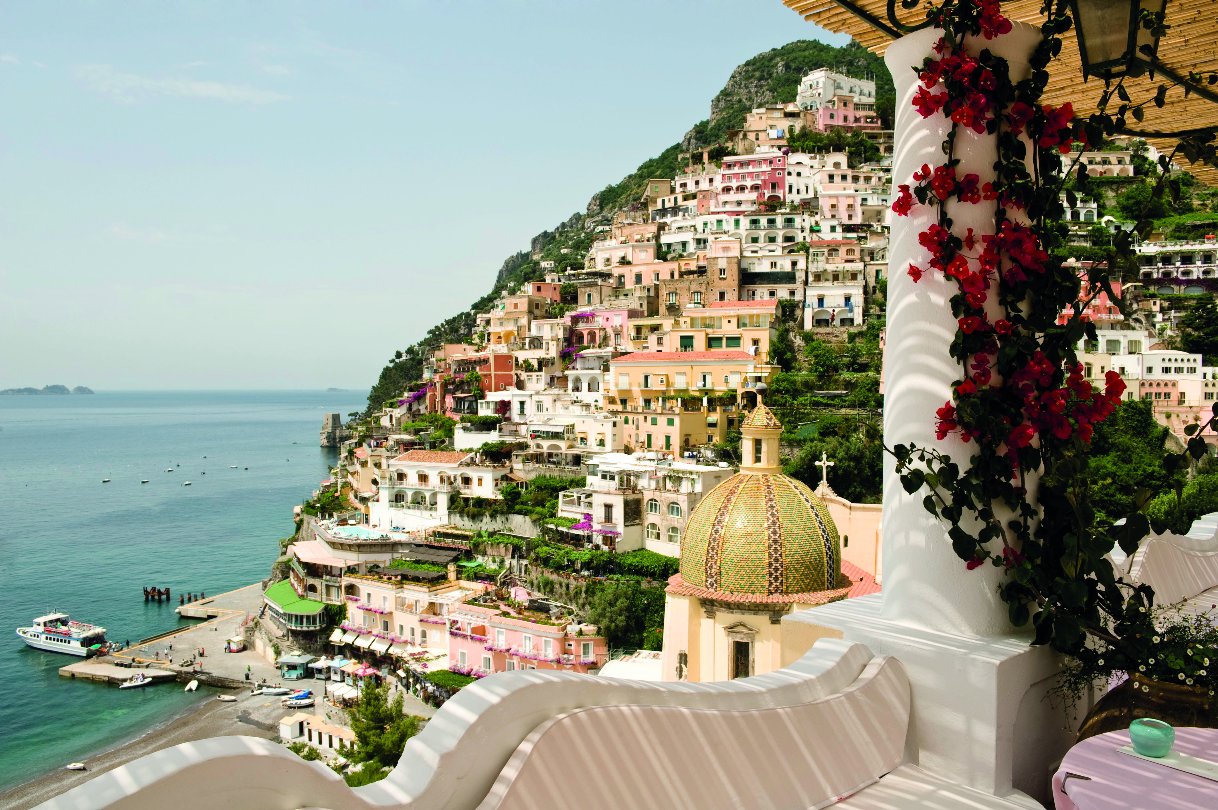 Le Sirenuse Amalfi Coast view from hotel balcony of cliffside town Positano and coast 