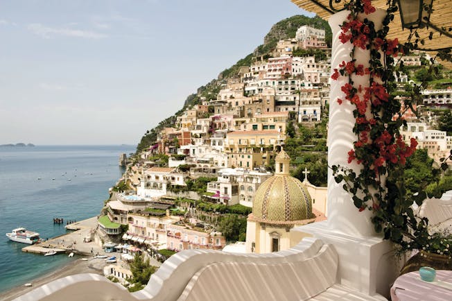 Le Sirenuse Amalfi Coast view from hotel balcony of cliffside town Positano and coast 