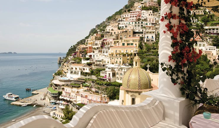 Le Sirenuse Amalfi Coast view from hotel balcony of cliffside town Positano and coast