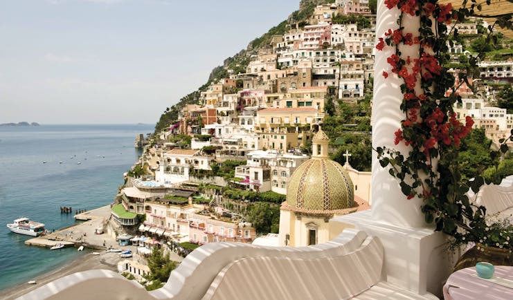 Le Sirenuse Amalfi Coast view from hotel balcony of cliffside town Positano and coast 