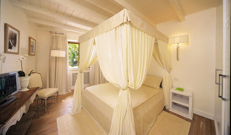 Mezzatorre Resort Amalfi Coast grand suite bedroom canopied bed