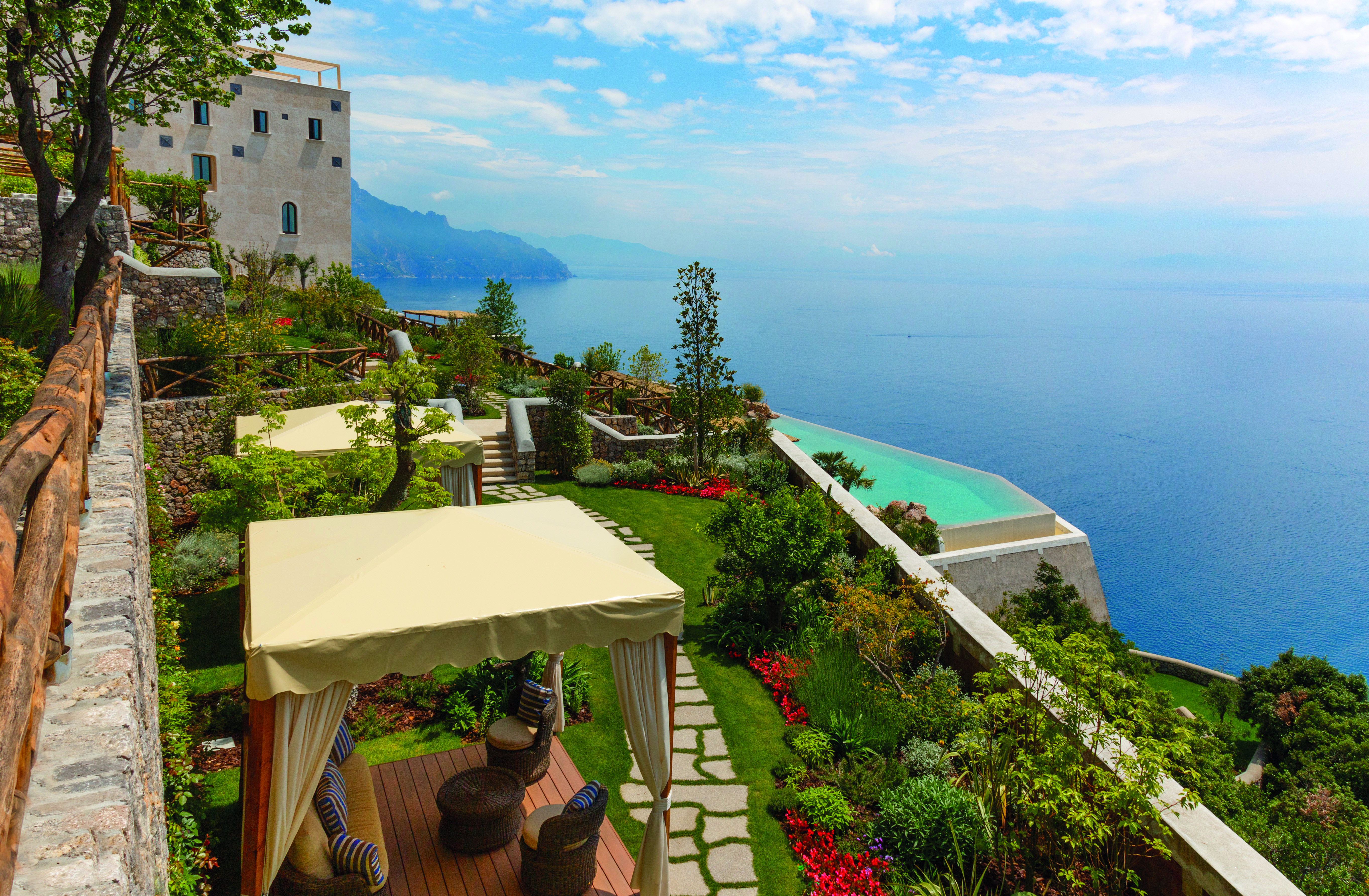 Monastero Santa Rosa Amalfi Coast gardens view of pool and ocean cabanas on lawn