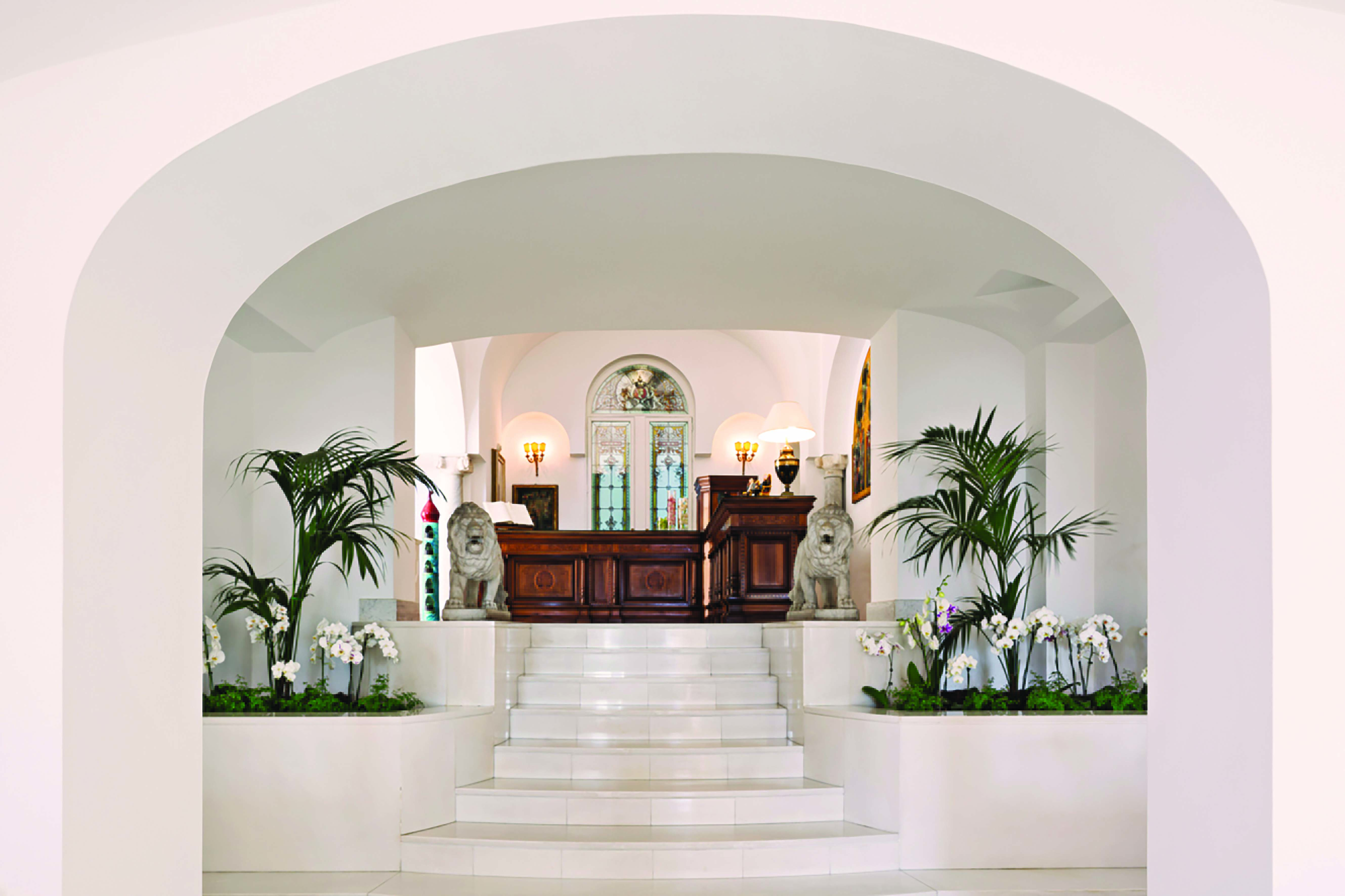 Palazzo Avino Amalfi Coast reception white marble floors heavy oak desk
