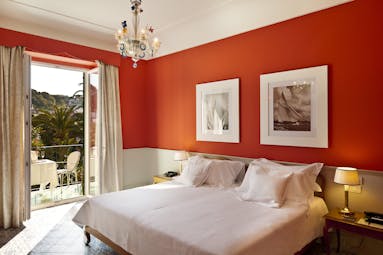 Regina Isabella superior room, double bed, tiled floor, chandelier, bright elegant decor, doors leading to private balcony