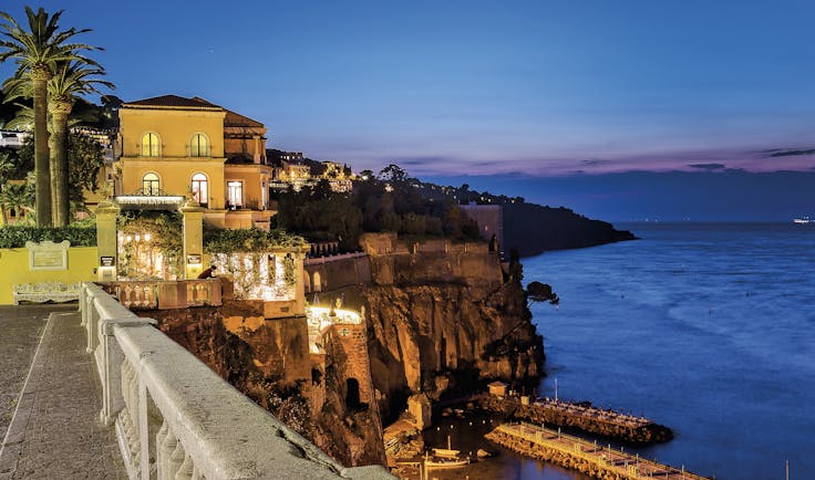 Bellevue Syrene Amalfi Coast hotel exterior by night hotel on cliffside overlooking the sea