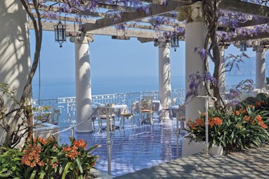 Bellevue Syrene Amalfi Coast pergola terrace outdoor dining overlooking the sea