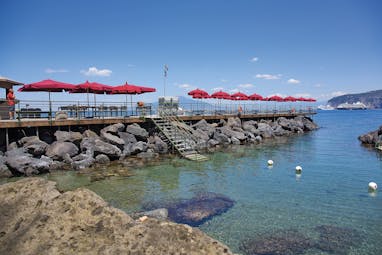 Bellevue Syrene Amalfi Coast private beach deck sun loungers and umbrellas