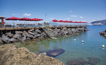 Bellevue Syrene Amalfi Coast private beach deck sun loungers and umbrellas