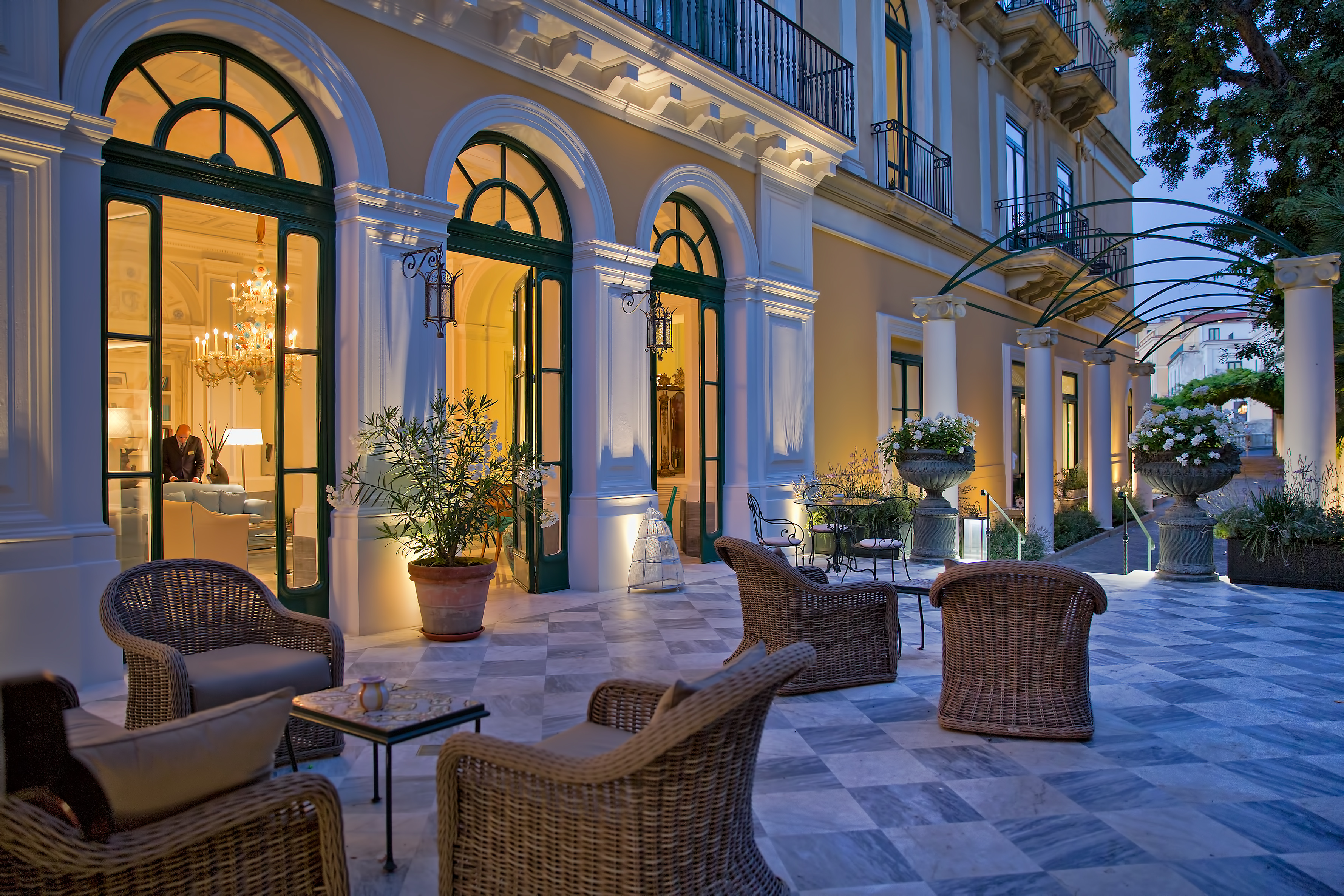 Bellevue Syrene Amalfi Coast reception patio by night out door seating marble patio