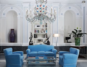 Bellevue Syrene Amalfi Coast reception interior colourful candelabra sofas and armchairs