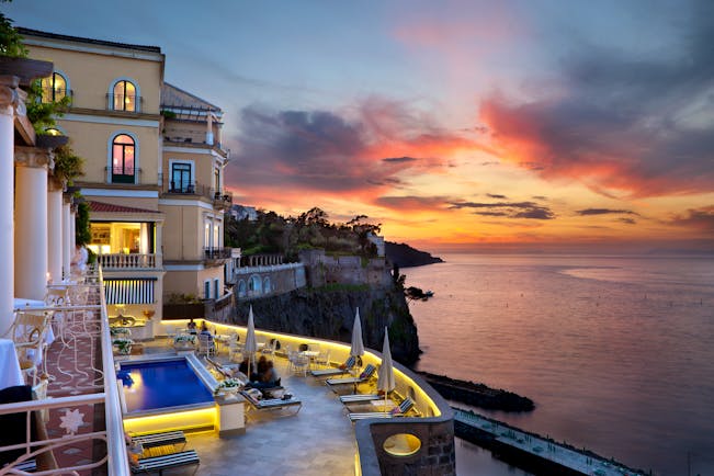 Bellevue Syrene Amalfi Coast terrace pool sun loungers overlooking the sea