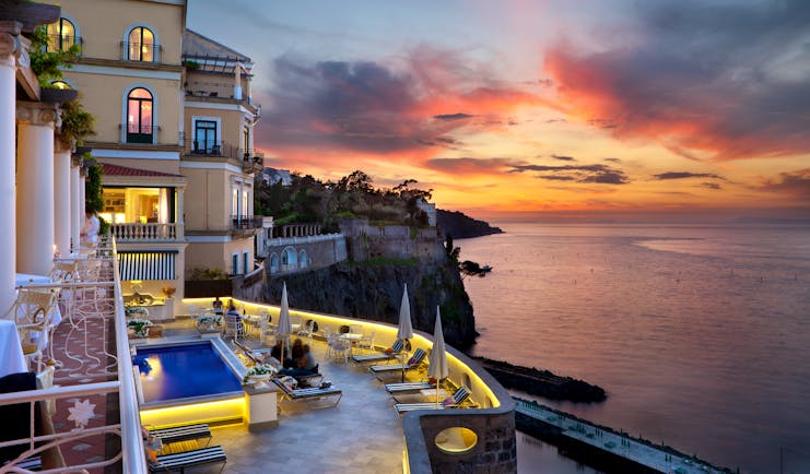 Bellevue Syrene Amalfi Coast terrace pool sun loungers overlooking the sea