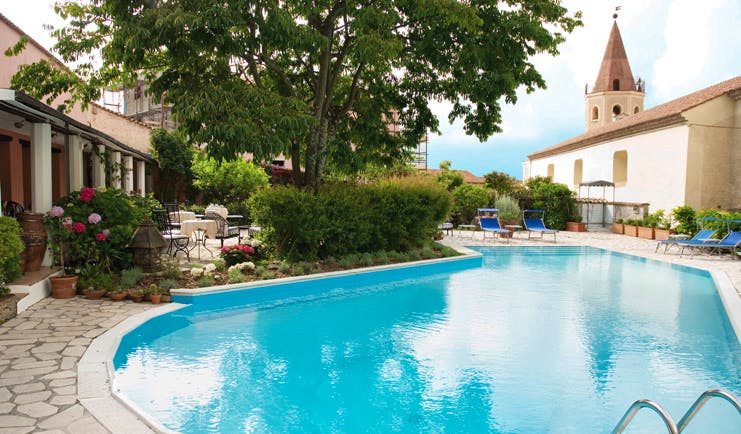 La Locanda Delle Donne Monache Basilicata pool sun loungers hotel building