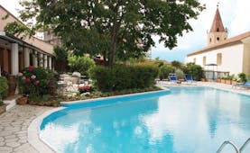 La Locanda Delle Donne Monache Basilicata pool sun loungers hotel building