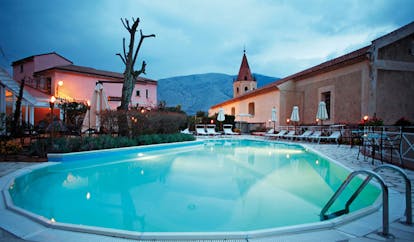 La Locanda Delle Donne Monache Basilicata pool and terrace sun loungers umbrellas
