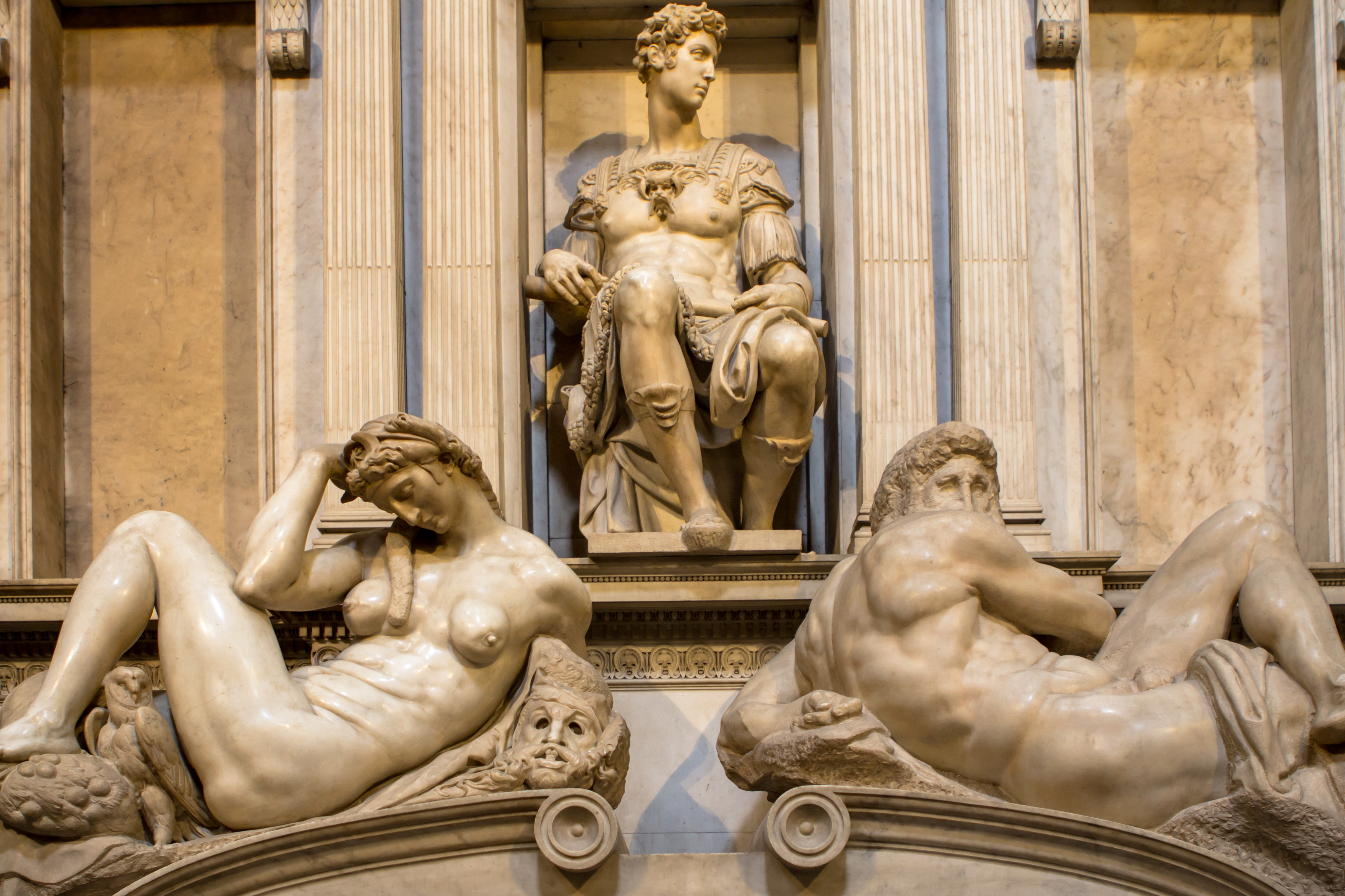 Michelangelo's sculptures of night and day on the marble tomb of Giuliano de Medici in Florence