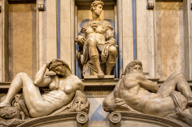 Michelangelo's sculptures of night and day on the marble tomb of Giuliano de Medici in Florence