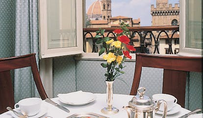 Hotel Bernini Palace Florence deluxe room breakfast table set by window cathedral views