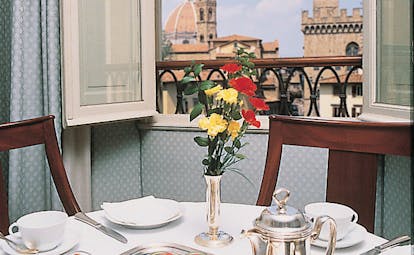 Hotel Bernini Palace Florence deluxe room breakfast table set by window cathedral views