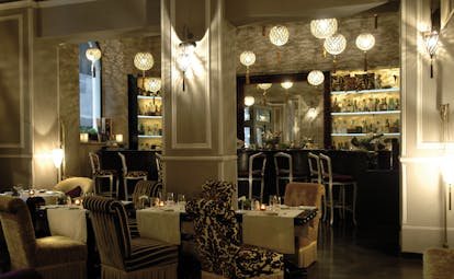 Hotel Bernini Palace Florence restaurant indoor dining tables chairs ornate décor