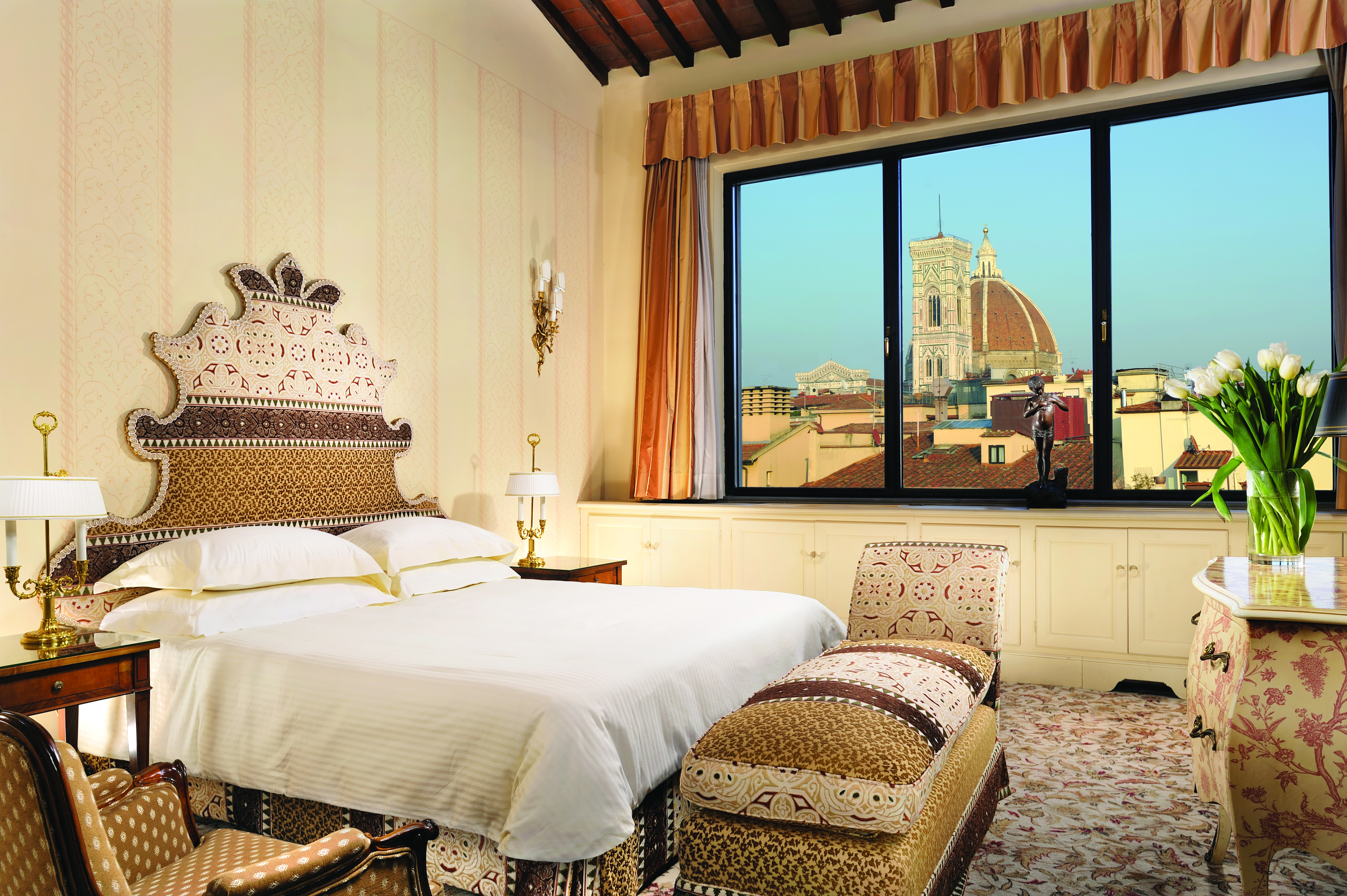 Helvetia and Bristol Florence panoramic suite king size bed large window with view of Duomo 