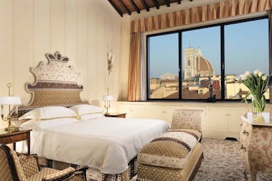 Helvetia and Bristol Florence panoramic suite king size bed large window with view of Duomo 