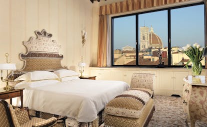 Helvetia and Bristol Florence panoramic suite king size bed large window with view of Duomo 