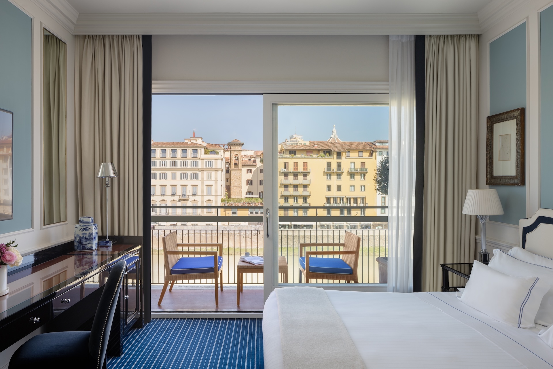 Hotel Lungarno river view room with balcony, historic buildings visible on the other side of the river
