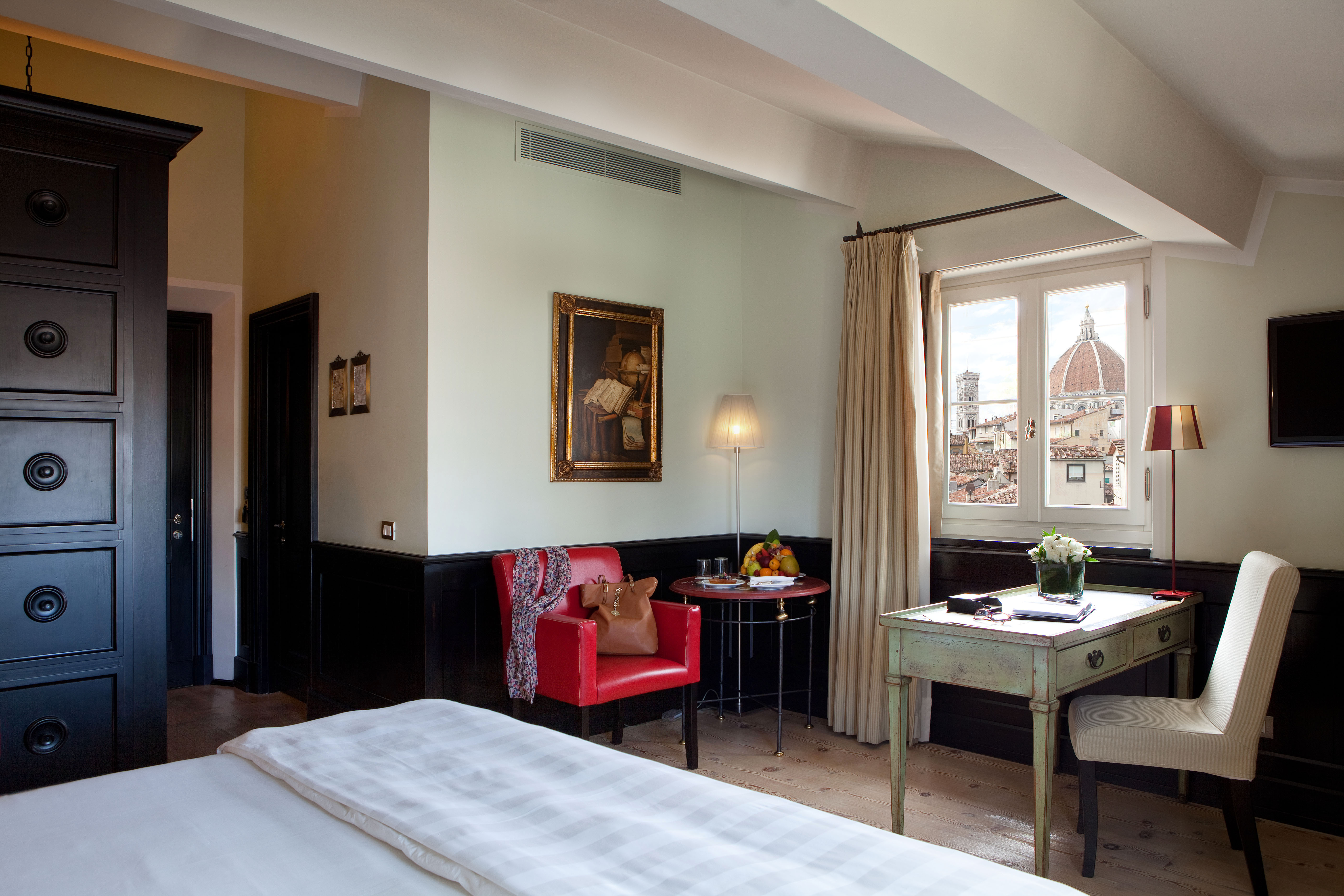 Relais Santa Croce Florence grand deluxe room bed desk window with partial Duomo view