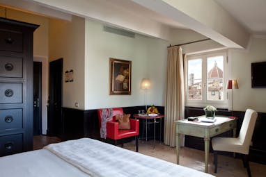 Relais Santa Croce Florence grand deluxe room bed desk window with partial Duomo view