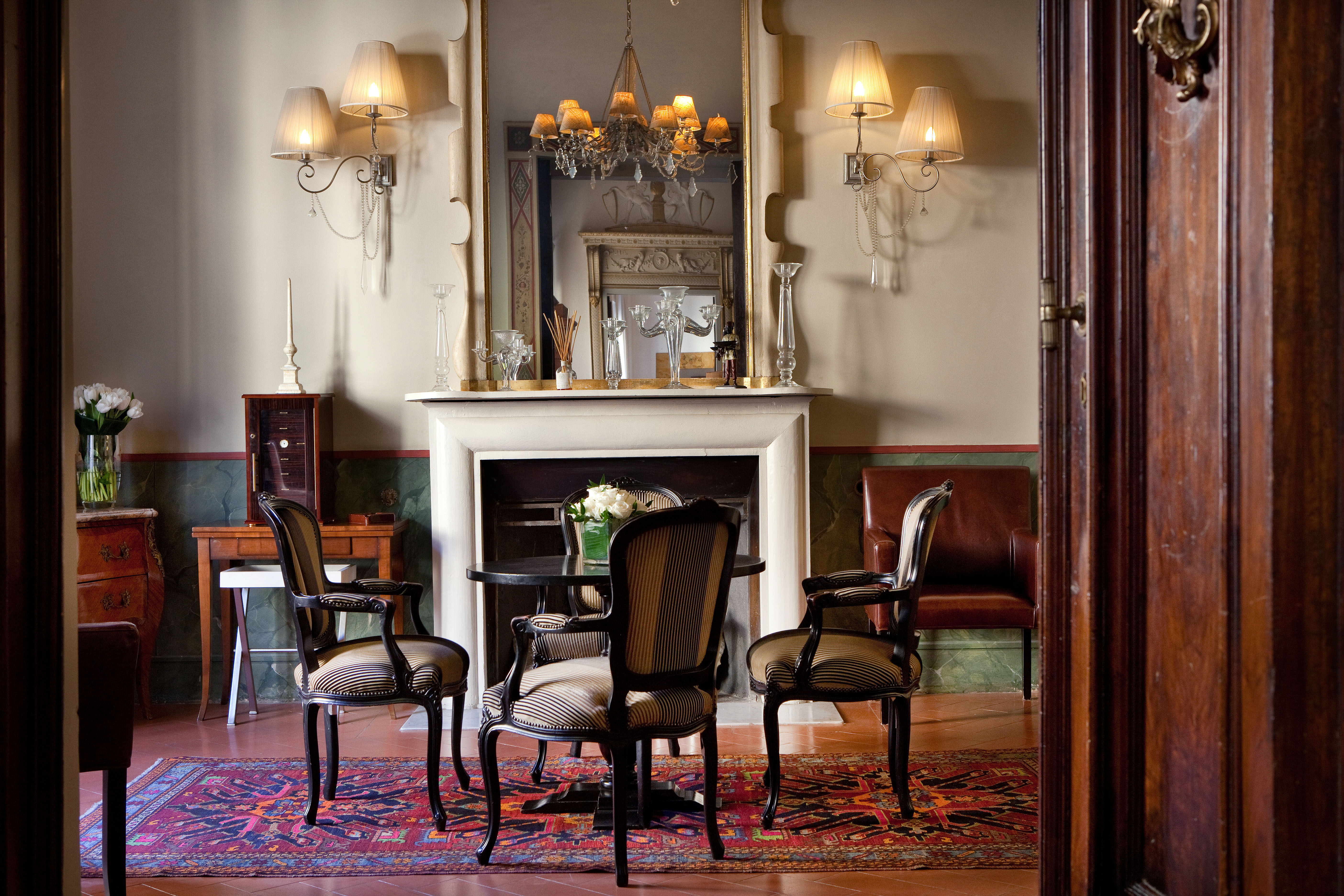 Relais Santa Croce Florence smoking room indoor seating area fireplace