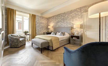 Calmcolours of greys and yellows of deluxe room at Hotel Savoy Florence