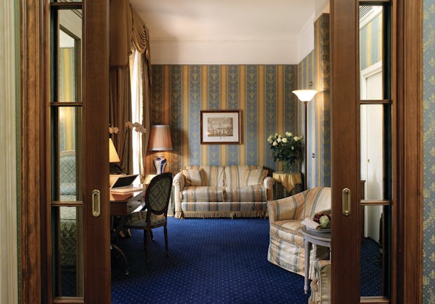 Hotel de la Ville Milan suite lounge area sofa armchair traditional décor