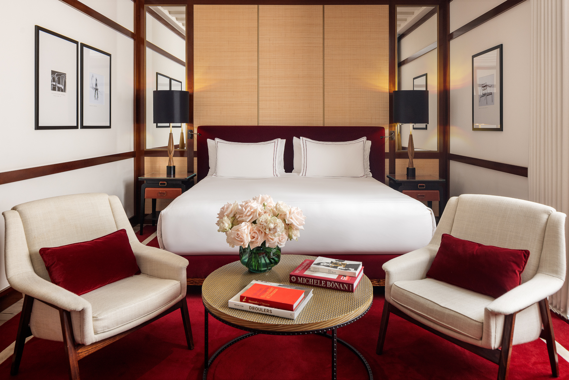 Hotel Portrait Milano Portrait Studio room decorated in red and white and dark wood, with a double bed and seating area