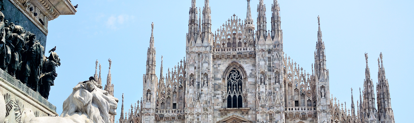 Grey stone cathedral with lion statue