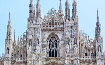 Grey stone cathedral with lion statue