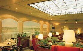 Palace Hotel Maria Luigia Parma lounge indoor communal seating area elegant décor