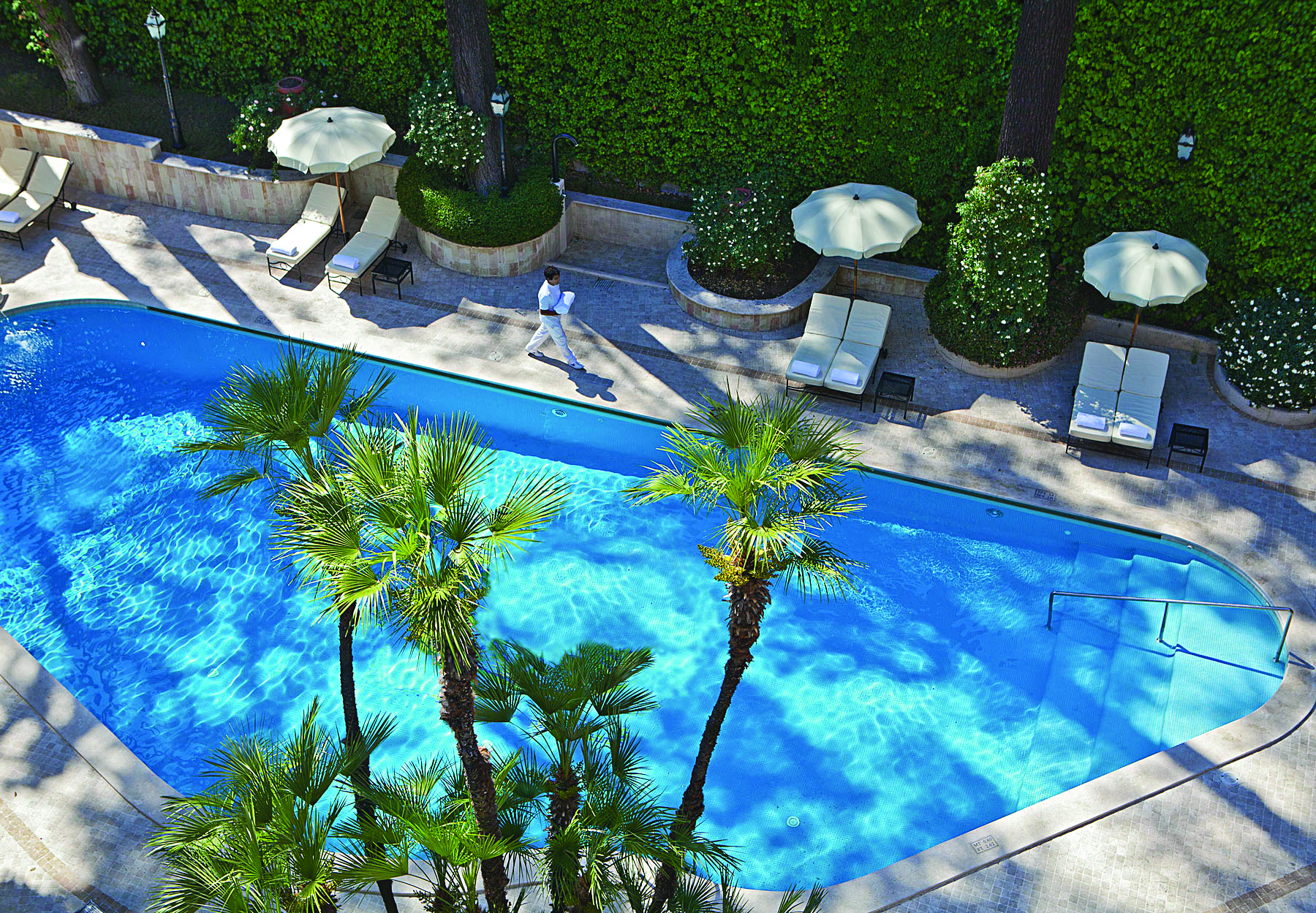 Aldrovandi Villa Borghese Rome pool sun loungers umbrellas