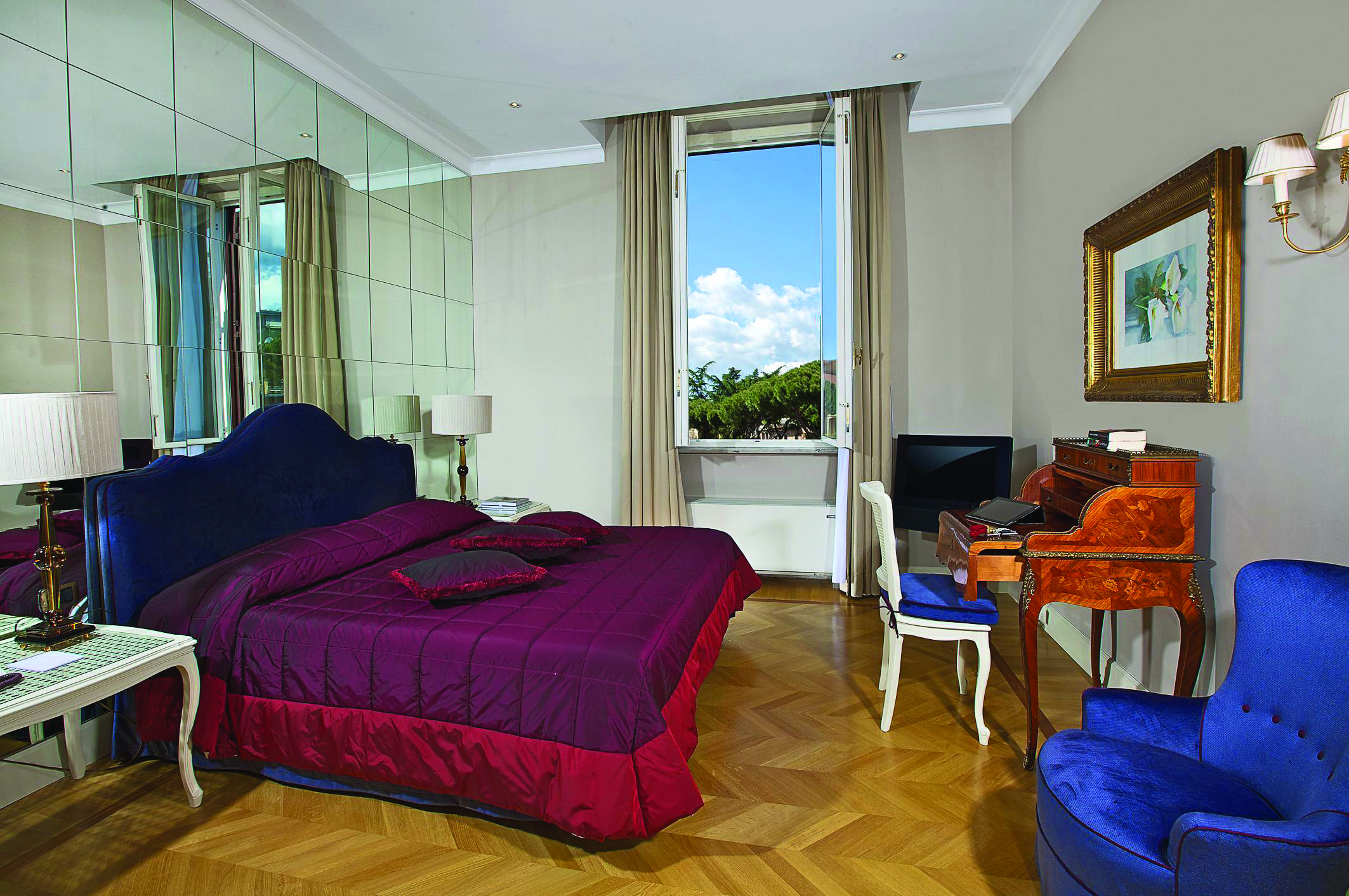Aldrovandi Villa Borghese Rome executive suite bedroom bed desk mirrored wall open window